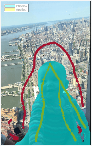 Additional foreground and background scribbles improve the separation of baby into foreground and city into background.